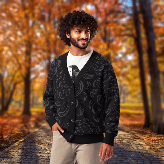 A man wearing an HGS Dusk Cardigan, a black patterned cardigan, in an autumn setting