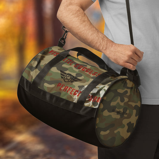 HGS Flight Gym Travel Bag is a Camouflage duffel bag with branding held by a person against a blurred natural background