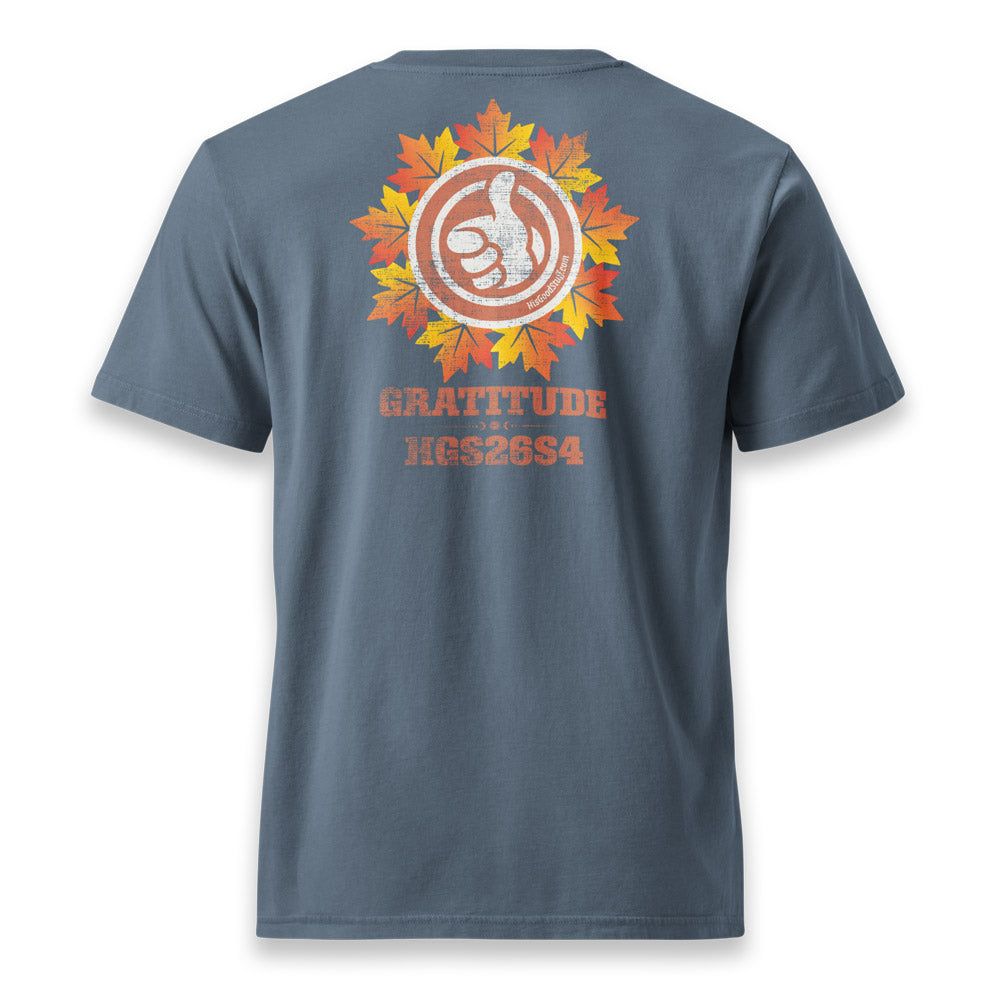 His Good Stuff's Autumn Catalog HGS26S4 Autumn Tee, back, relaxed fit, 100% ring-spun cotton, blue, short-sleeve, on a model against a white background. Graphic displays a large distressed HGS Fall thumbs-up icon with the letters "GRATITUDE" and "HGS26S4 underneath.