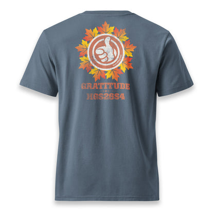 His Good Stuff's Autumn Catalog HGS26S4 Autumn Tee, back, relaxed fit, 100% ring-spun cotton, blue, short-sleeve, on a model against a white background. Graphic displays a large distressed HGS Fall thumbs-up icon with the letters "GRATITUDE" and "HGS26S4 underneath.