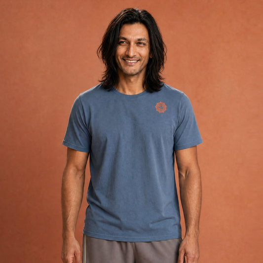 His Good Stuff's Autumn Catalog HGS26S4 Autumn Tee, front, relaxed fit, 100% ring-spun cotton, grey, short-sleeve, on a model against a flat Brandied Melon background. Graphic displays in the top right a small HGS Fall thumbs-up icon