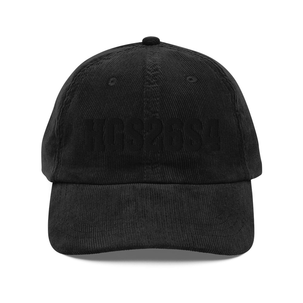 His Good Stuff's Autumn Catalog HGS26S4 Corduroy Cap, front, 100% cotton corduroy with an adjustable golden buckle in the back, on a white background. Graphic displays in black thread, 3-D embroidered HGS26S4