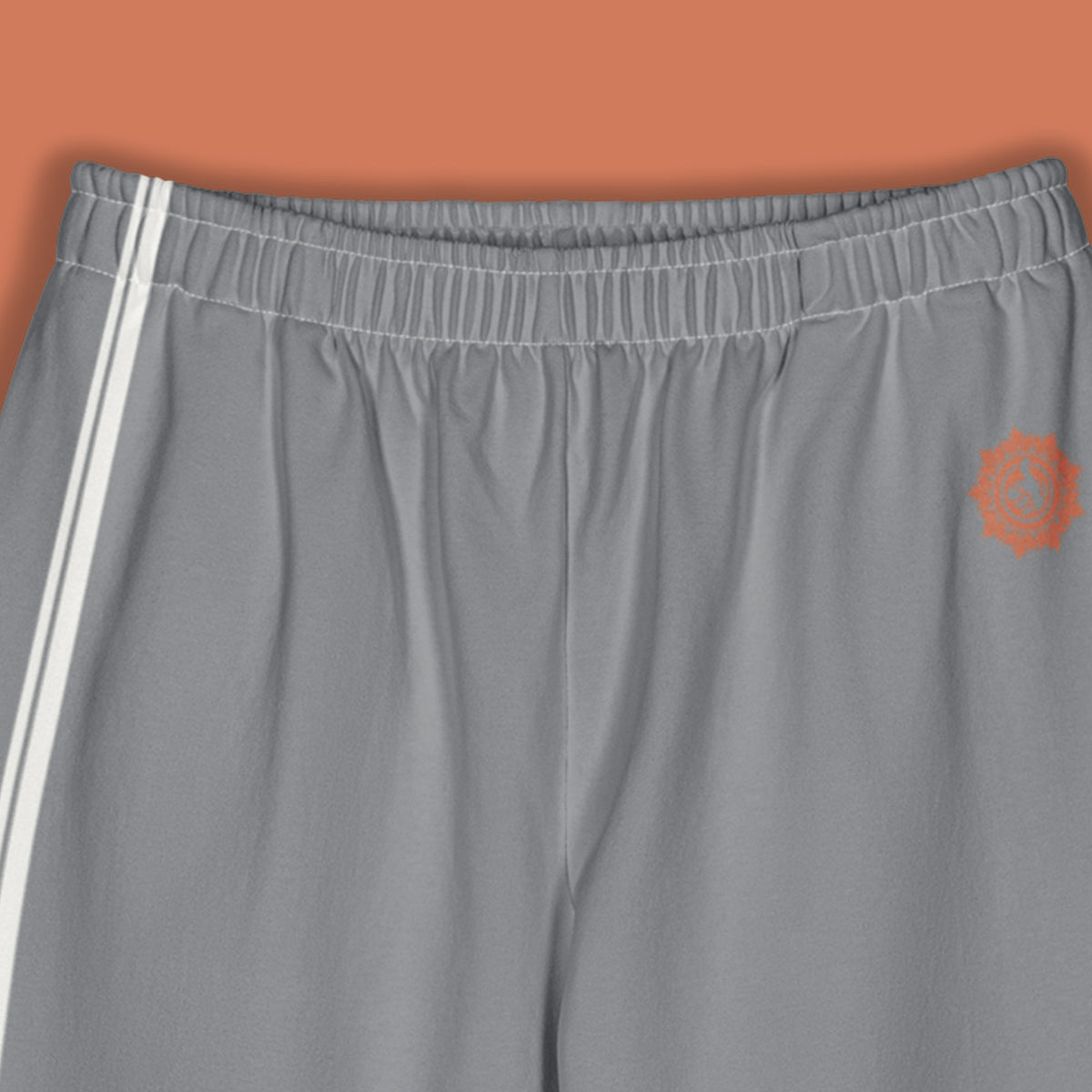His Good Stuff's Autumn Catalog HGS26S4 Cotton Pants, front detail, wide-leg, heavyweight cotton-spandex blend, ultimate grey with 2 cloud dancer white stripes, on a model against a flat Brandied Melon background. Graphic displays in the top right a brandied-melon-colored HGS Fall thumbs-up icon.