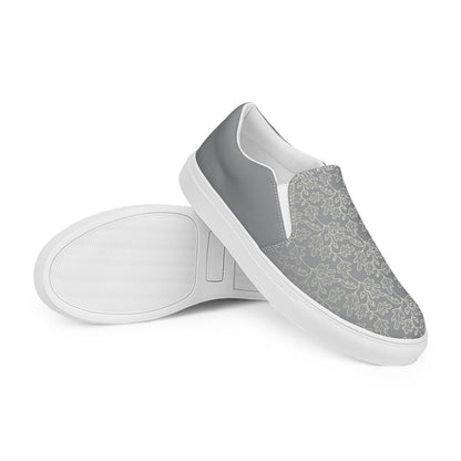 His Good Stuff's Autumn Catalog HGS26S4 Slipper Shoes, stacked view, breathable lining, soft insole, elastic side accents, padded collar and tongue, on a white background. Ultimate Gray with cloud dancer white oak leaf floral pattern over the toes. 
